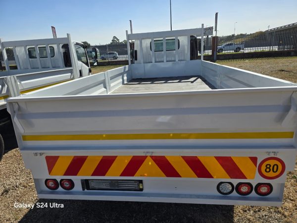 Used 2012 Isuzu NPR 400 Dropside Truck Auto - Image 5