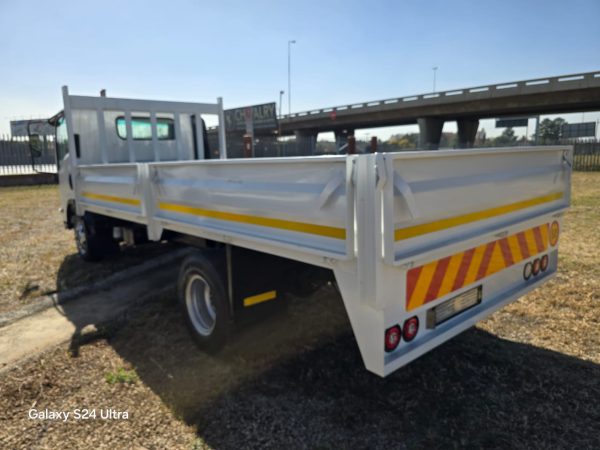 Used 2012 Isuzu NPR 400 Dropside Truck Auto - Image 4