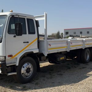 2016 NISSAN UD 90 TAG AXLE DROPSIDE TRUCK